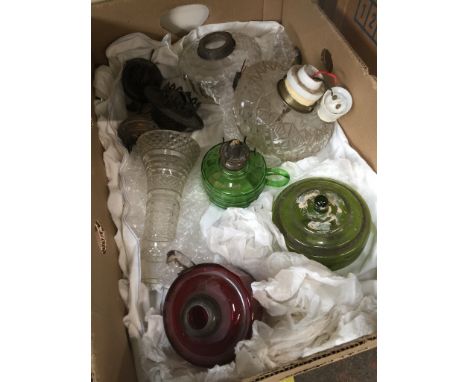 A box containing 4 oil lamp reservoirs, various brass oil lamp parts, and a converted reservoir 