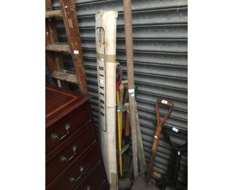 Pair of cast metal table trestles, 2 bundles of garden tools, a Boots projector and a set of wooden stepladders. 