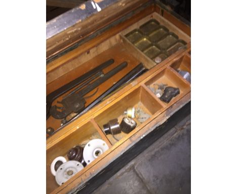A joiners toolbox containing various tools. 
