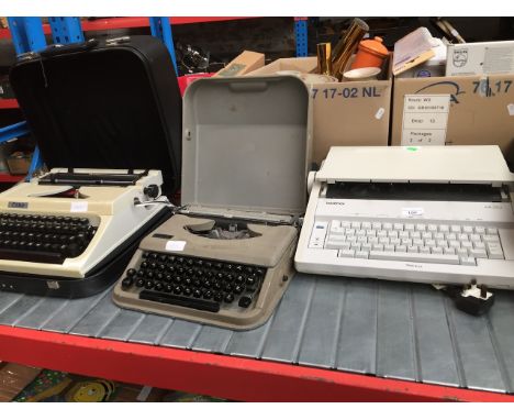 A Brother AX-210 typewriter, a vintage Antares portable typewriter and a vintage Erika typewriter. 