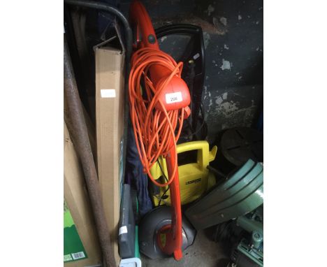 A Karcher K 2.87 pressure washer and an electric garden strimmer. 