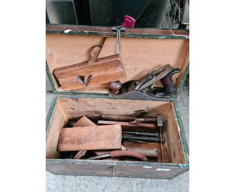 A toolbox containing vintage tools