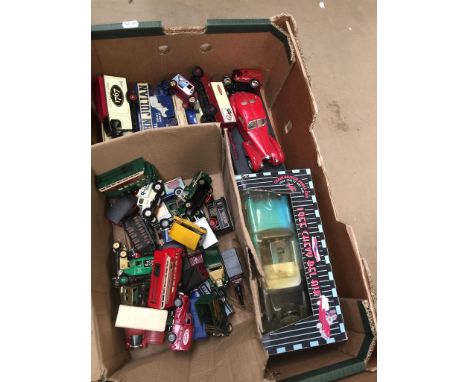 A box containing various die-cast model vehicles, Corgi etc. 