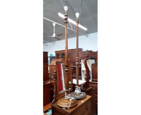 An oak standard lamp and a stained beech standard lamp. 