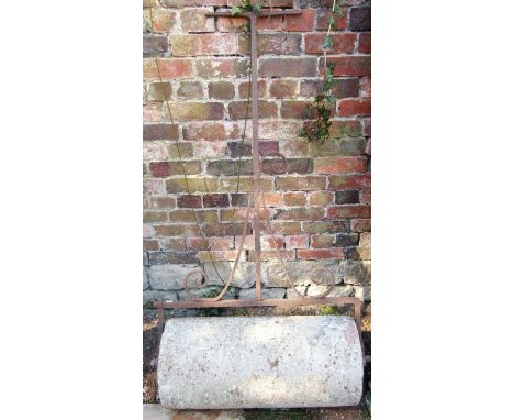 A 19th century stone garden roller with wrought iron T shaped handle and scrolled detail, the roll 71 cm wide (af) 