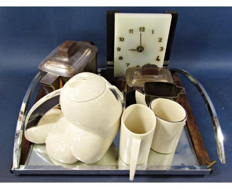 An Art Deco Ercuis silver plated three piece tea service with rosewood handles and matching tray (af), a china Art Deco style
