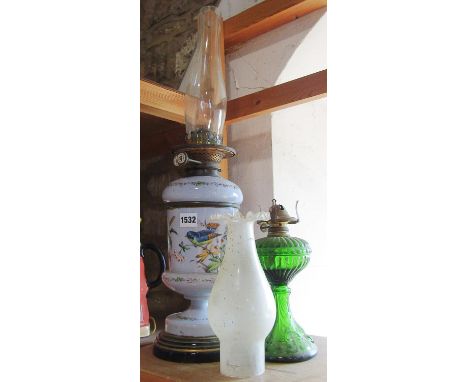 A James Hick &amp; Sons oil lamp with a hand decorated flower and bird scene, chimney but no shade and a green glass oil lamp