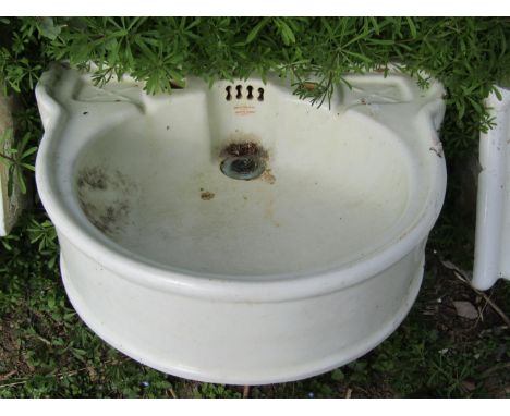 A Doulton &amp; Co Ltd Lambeth London, bow fronted cream glazed stoneware hand basin together with a further pair with transf