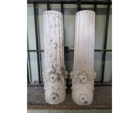 A pair of small carved white marble architectural fluted cylindrical columns with fluted and floral detail, 54 cm high x 15 c