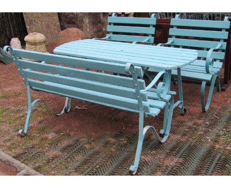 A vintage four piece sprung steel framed and painted garden suite with timber lathes comprising two seat bench, pair of armch