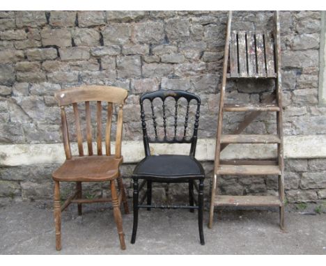 A Windsor elm and beechwood lathe back kitchen chair together with an ebonised single chair and a vintage folding wooden step