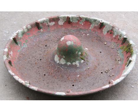 A vintage cast iron Mexican hat shaped pig feeding trough approx 3ft in diameter 