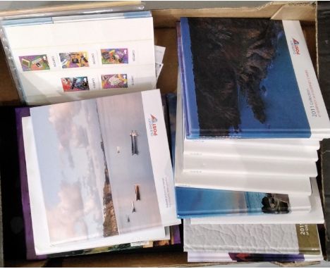 A box of Guernsey and Alderney year books 2003-13 (2006 and 2008 x 2), and a folder of loose stamps and First Day Covers also