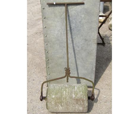 A 19th century stone garden roller with wrought iron T shaped handle, approximately 60 cm wide (full width including frame) 