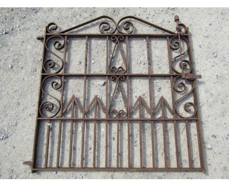 A heavy gauge iron pedestrian gate with scroll work detail and sprung lever latch, 112 cm wide x 110 cm high, together with o