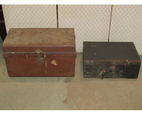 A tin trunk and a further timber trunk containing a collection of unsorted workshop tools 