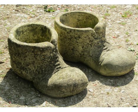 A pair of novelty cast composition stone garden planters in the form of old boots, 50 cm long x 22 cm high, together with a m