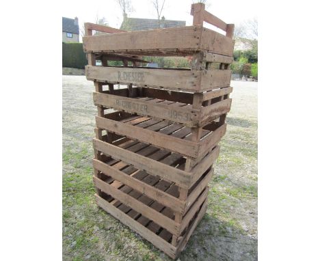A stack of nine vintage wooden rectangular potato trays/crates, some with printed lettering R. Chester and W E Franklin, 76 c