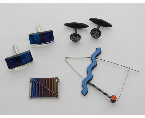 Group of designer costume jewellery; Joel Degen stainless steel and adonised aluminium brooch, Anne Finlay mixed media brooch