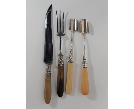 A pair of Victorian horn handled carving knife and fork, and two bone handled Stilton scoops (4) 