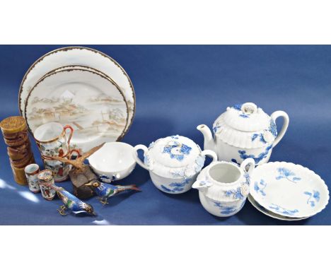 Three piece continental porcelain tea set, teapot, sugar basin and cream jug with applied and overlaid floral detail, pair of