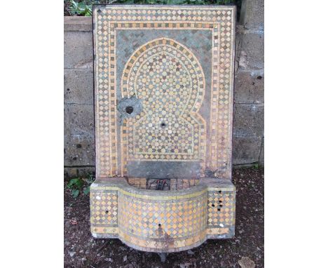 A weathered Moroccan iron framed mosaic fountain with bow fronted basin/reservoir, 76cm wide x 122cm high approx (af) 