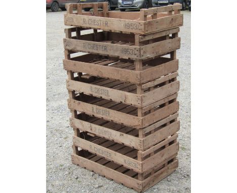 A stack of eight vintage wooden rectangular potato crates with printed lettering R. Chester, etc (af) 76 cm long x 45 cm wide