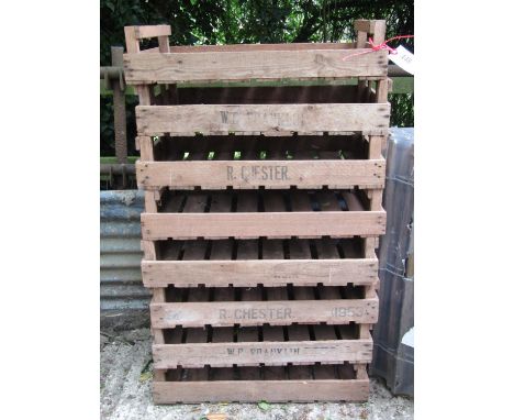 A stack of eight vintage wooden rectangular potato trays/crates, some with printed lettering R. Chester and W E Franklin (af)