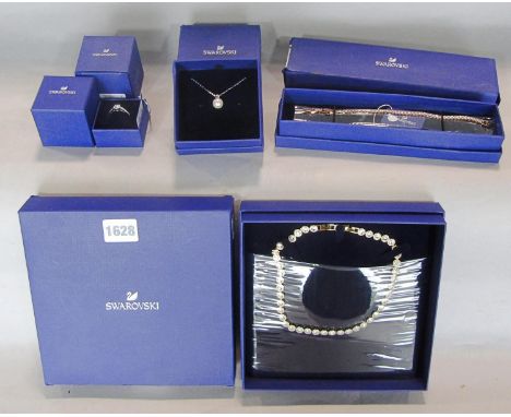 Swarovski crystal jewellery, a ring with a solitaire crystal, a pearl pendant necklace, and necklace and a bracelet, 4 