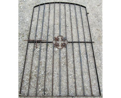 An old ironwork pedestrian gate with open vertical cylindrical bars with arrow head finials, 115cm wide x 150cm high (lacks f