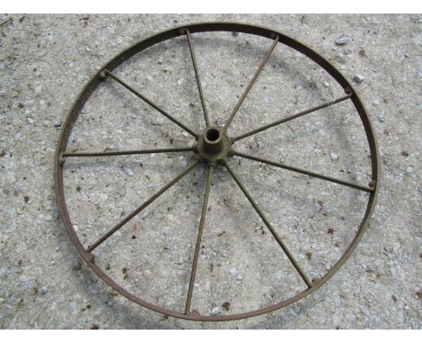 A vintage iron nine spoke implement wheel, 122 cm (4ft diameter) 