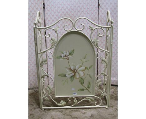 A contemporary ironwork folding firescreen metal with painted finish detailing flowers 