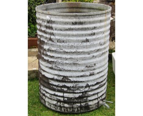 A vintage galvanised steel ribbed cylindrical water butt complete with tap, 67 cm diameter x 90 cm high 