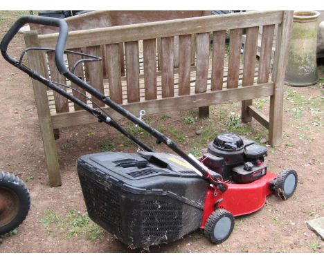A Sovereign petrol driven rotary lawn mower with classic XC35 Briggs and Stratton engine (believed to be only used a handful 