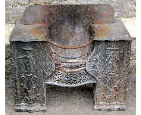 A small regency cast iron fire grate, the shaped basket flanked by two panels depicting classical characters, 75cm wide x 54c