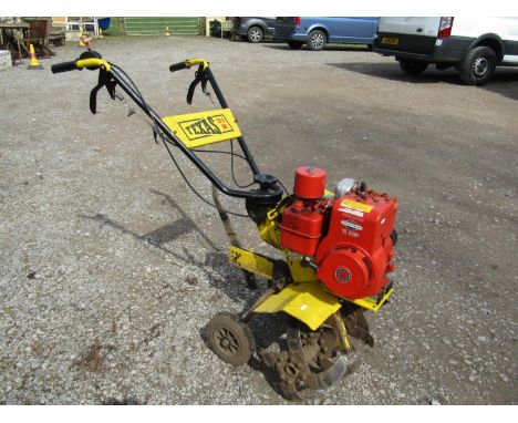 A Texas TD5BR petrol driven garden rotovator with 5 HP Briggs &amp; Stratton engine 