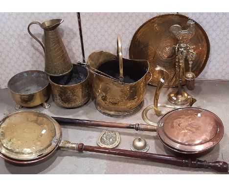 A collection of 19th century and other copper and brassware including a cylindrical tapering insulated water jug, two warning