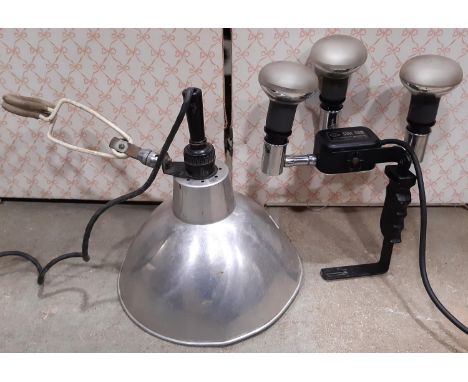 A vintage Sine Sun camera, with further vintage lamp 