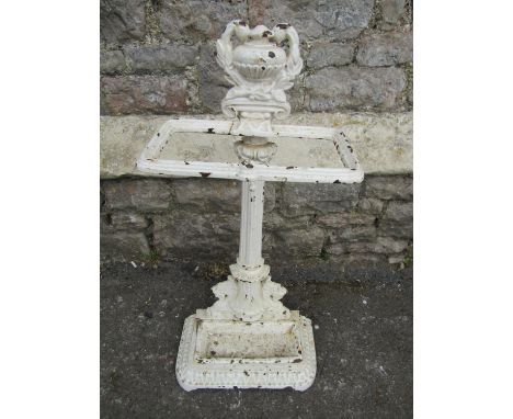 A mid-19th century cast iron stick stand, the central column flanked by lions beneath a laurel encrusted urn 
