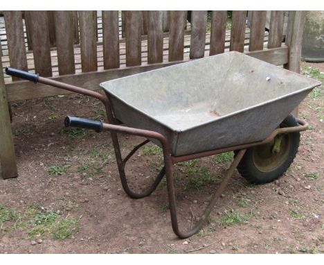 A vintage wheelbarrow with galvanised body and pneumatic tyre 