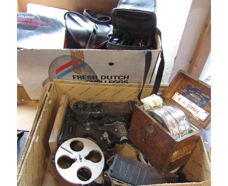 Photographic Equipment including a vintage movie projector, Polaroid cameras, a Fujifilm waterproof camera, lenses, and a pig
