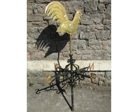 An old ironwork weather vane with scrolled detail and gilt painted cockerel surmount, 130 cm high 