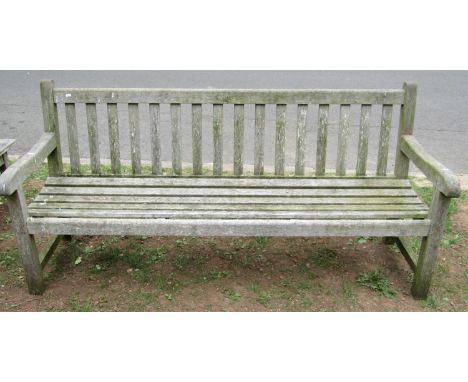 A good quality vintage weathered teak garden/park bench with slatted seat and back 180 cm long 