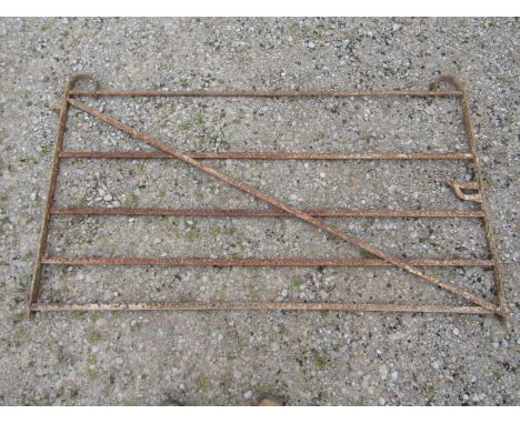An old ironwork five bar gate with thumb latch, 187cm wide x 108cm high 