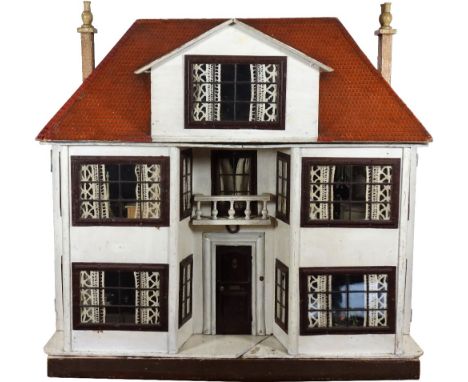 A large and impressive Lines Bros Triang painted wooden dolls house, English 1920s, with painted white façade and paper brick