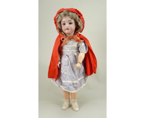 A Heinrick Handwerck/S&amp;H bisque head doll, German circa 1910, with weighted blue glass eyes, painted lashes, raised brows