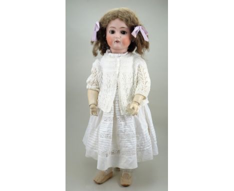 A large Kammer &amp; Reinhardt/S&amp;H bisque head doll, German circa 1910, with weighted brown glass eyes, raised brows, ope