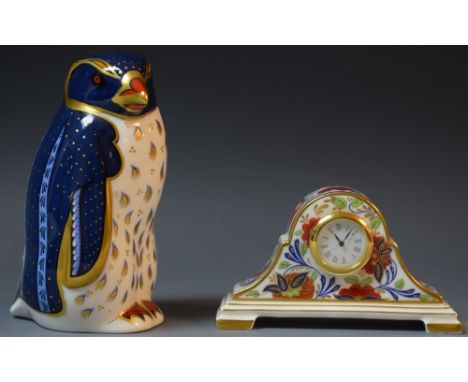 A Royal Crown Derby paperweight, Rockhopper Penguin, gold stopper;  an Arita pattern miniature mantel clock, second quality, 