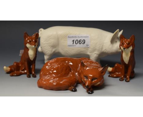 A Beswick model of a fox, two other hunting set foxes; a pig Ch. Wall Boys (4) 