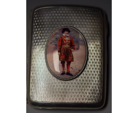 A George V silver cigarette case, later applied with a plaque of a beefeater, Birmingham 1922